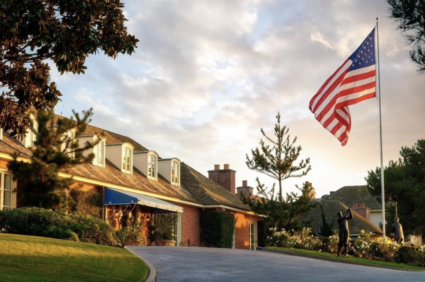 Front of estate with American flag
